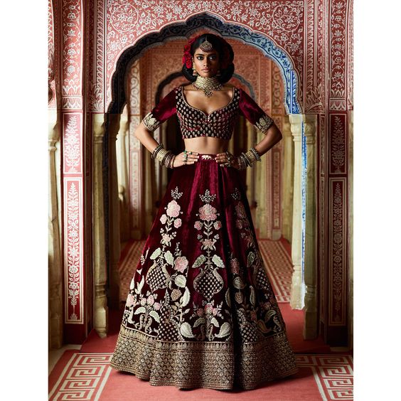 Bordeaux velvet lehengas with intricate zardosi